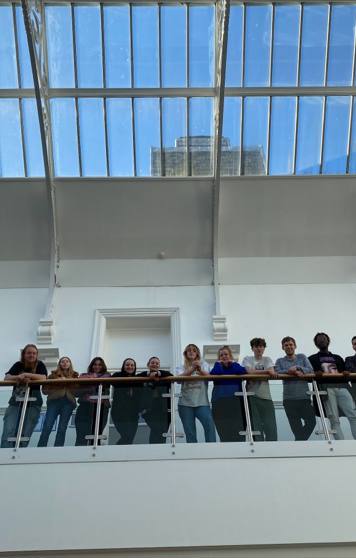 Music Business Students Looking Down Over Bannister Music Business Students Looking Down Over Bannister